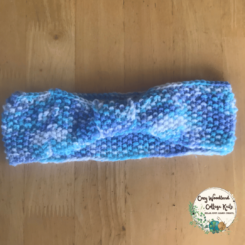 a teens hand knitted blue sky bow headband