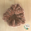 a caramel (tan brown) velvet scrunchie