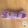 a child's bow headband in candy floss