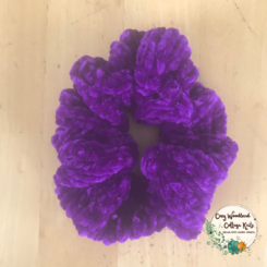a purple velvet scrunchie