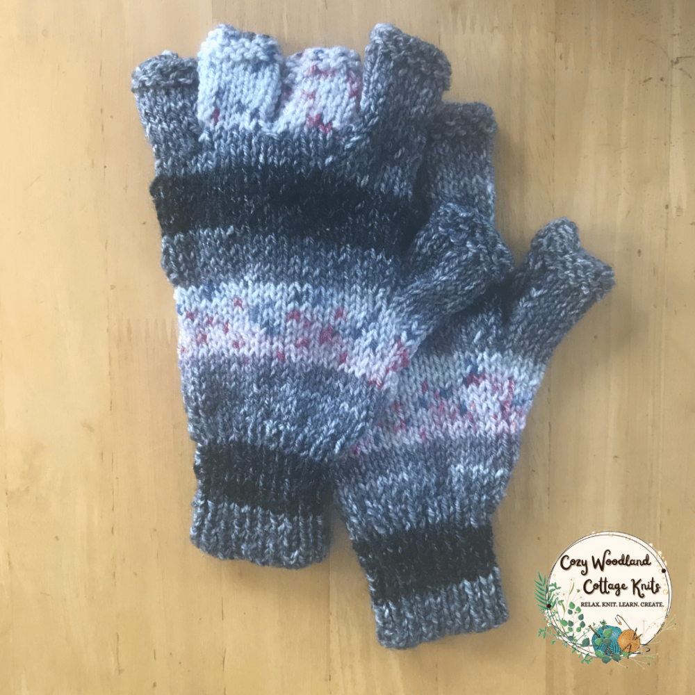 a hand knitted set of striped fingerless gloves.