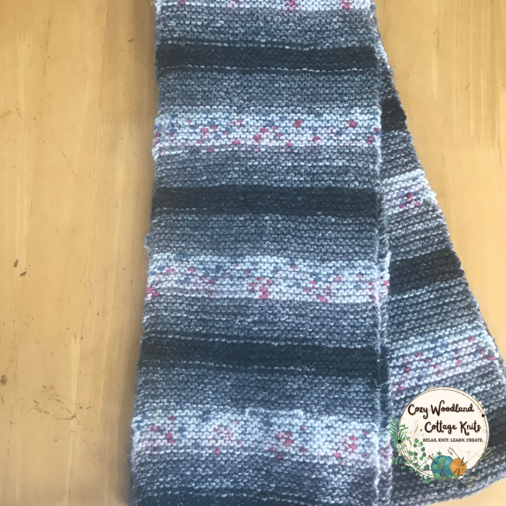 a hand knitted striped fingerless scarf