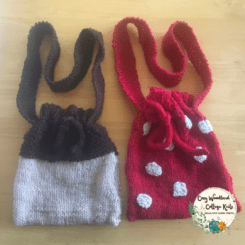 Photo of the toadstool and acorn woodsy bags. The toadstool bag is red with white spots. The acorn bag is tan at the bottom and dark brown at the top.